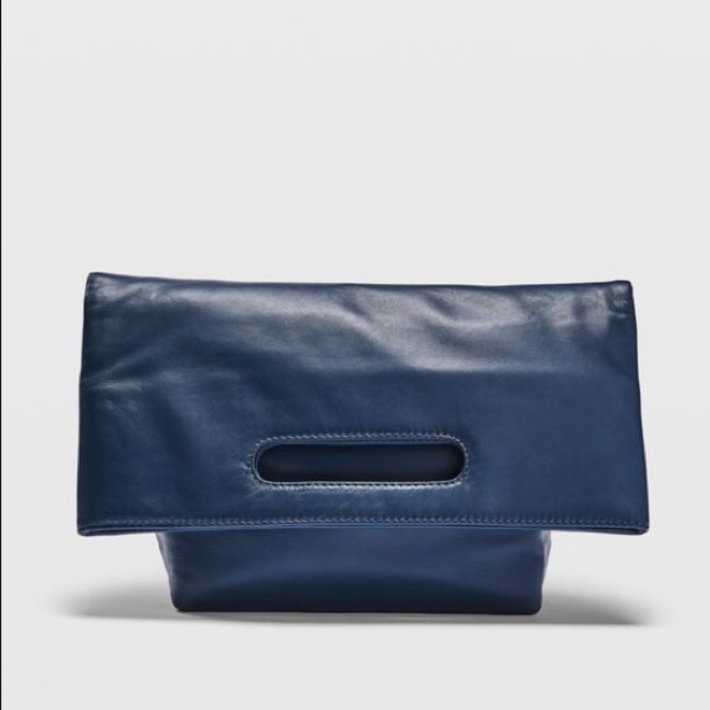 Club Monaco Excellent condition navy folded over or handheld clutch. Never used!